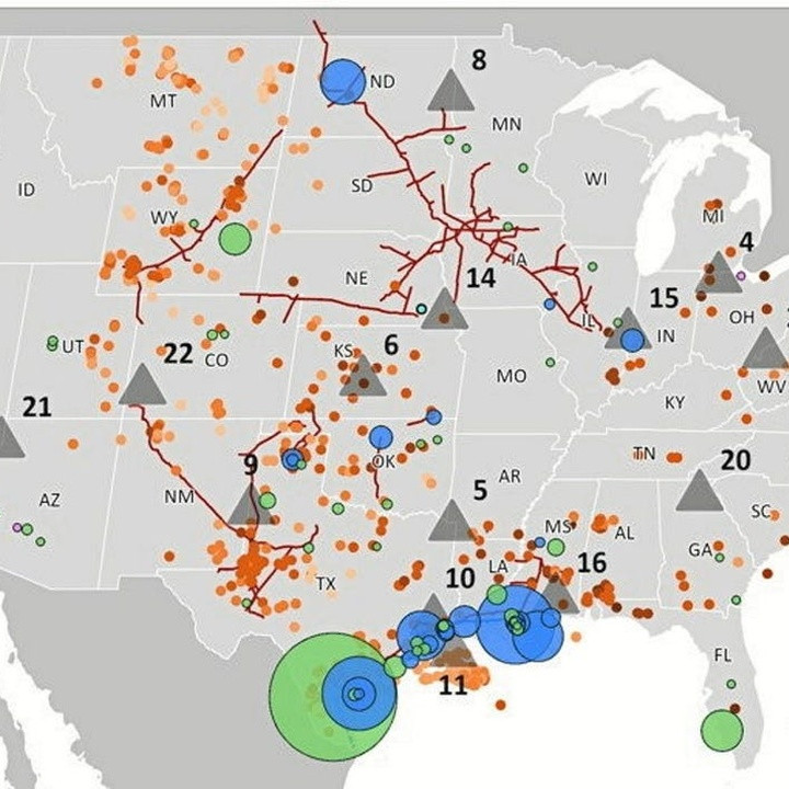Map of the United States with colored markers: orange dots, blue and green circles, red fault lines, and gray triangles marking various geological features or events.